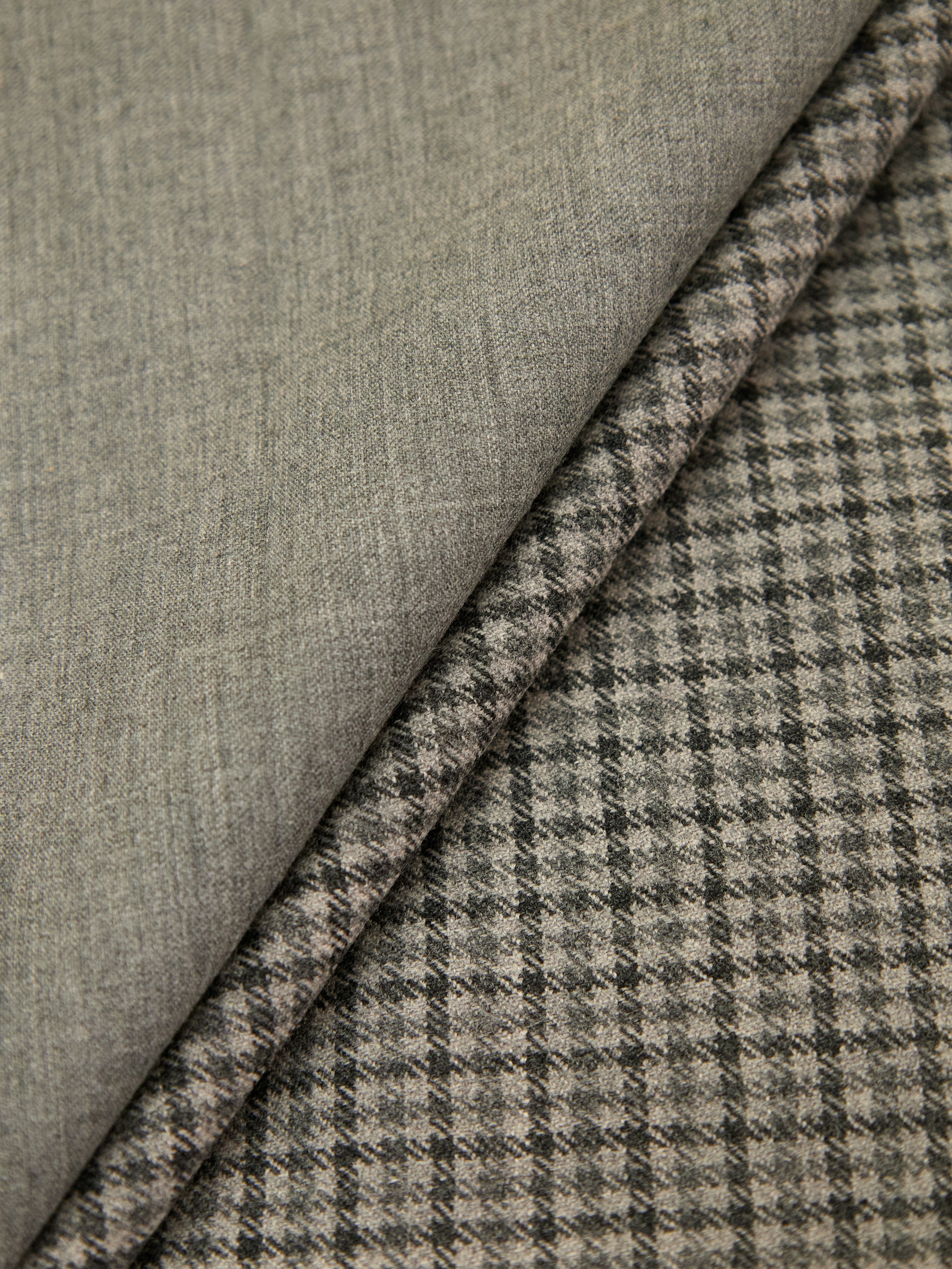 Two fabric swatches, one plain gray and the other checkered, on a white background.